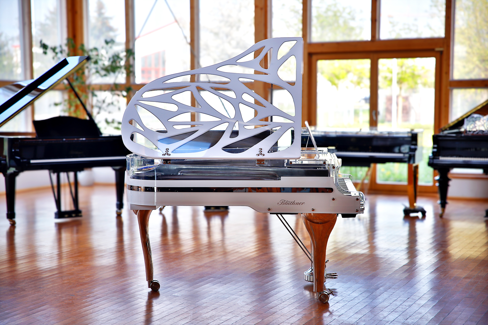 White Blüthner Crystal Hive Elegance Grand Piano with a titanium coloured iron frame
